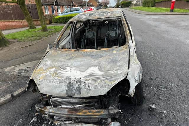 Police are investigating after a burnt-out car was abandoned in Huthwaite this morning