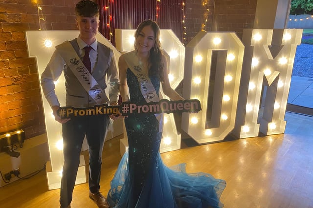 The Prom King and Queen pose for a photo.
