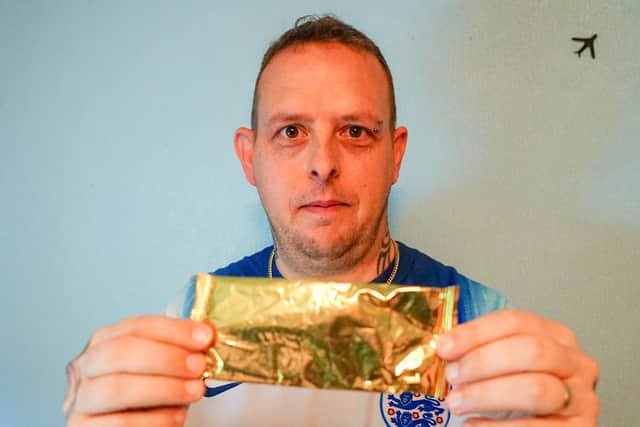 Ian Godber with the chocolate wrapper.