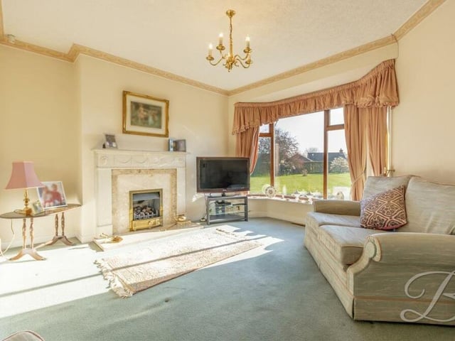 As well as the lounge, the £580,000 bungalow boasts this lovely snug, which is perfect for putting your feet up and enjoying cosy nights in.