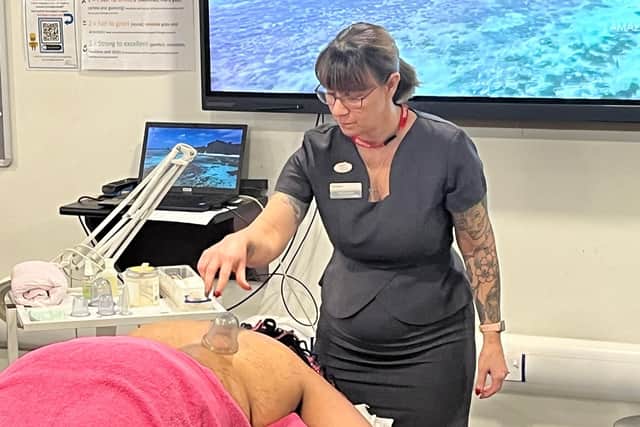 Michelle Bailey performed the cupping massage