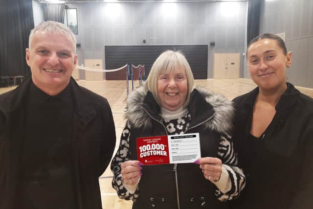 Everyone Active contract manager Lorenzo Clark and sales manager Katie Quinn, right, congratulate Jean Patterson, the 100,000th customer at Kirkby Leisure Centre.