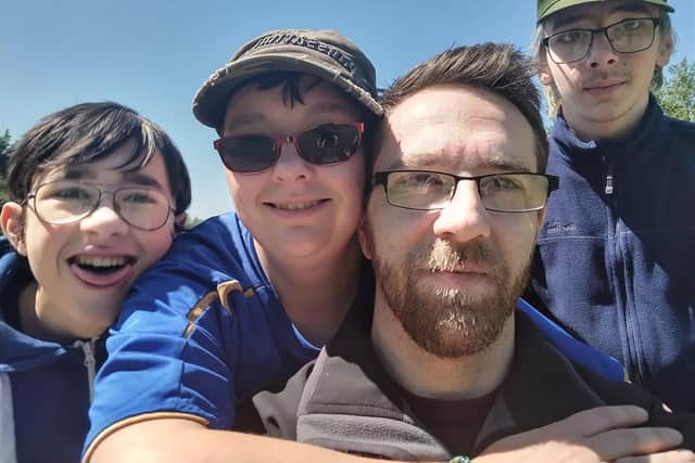 David, pictured alongside his family.