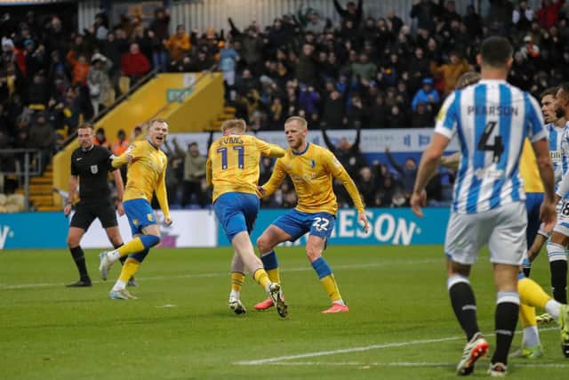 Will Evans scores during the Sky Bet League 1 match against Huddersfield Town FC at the One Call Stadium, 21 Sept 2024, Photo credit Chris & Jeanette Holloway / The Bigger Picture.media