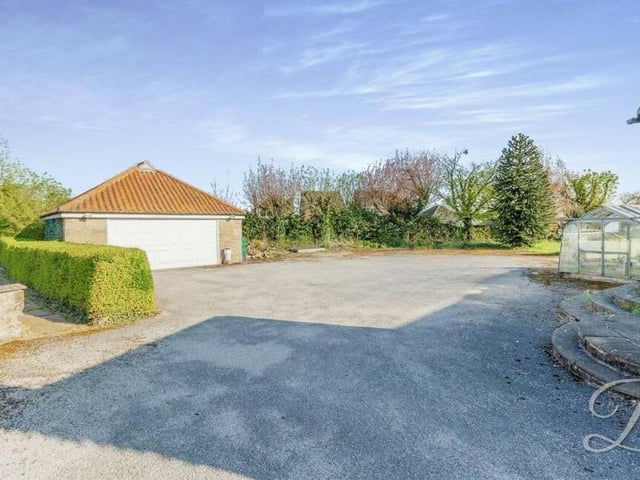 Jasper Lodge benefits from a huge driveway that offers space for off-street parking. It also leads to a solidly-built double garage.