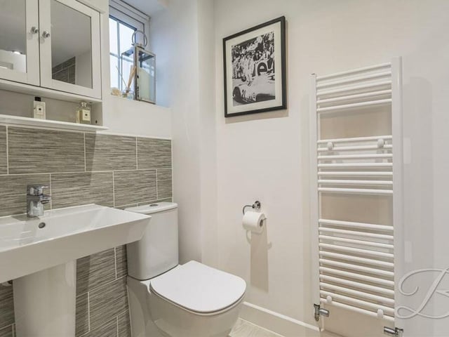 The excellent en suite shower room that is attached to the main bedroom. A three-piece suite features a WC and wash basin.
