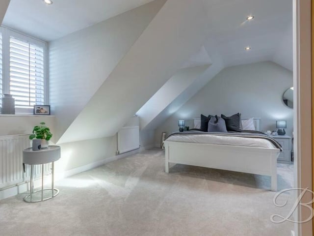 Another bright and spacious bedroom that is the perfect retreat after a hard day.