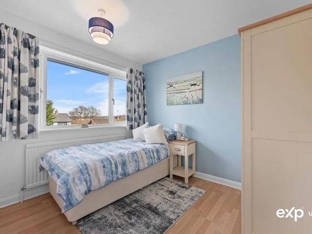 The property features four bedrooms, perfect for a growing family.