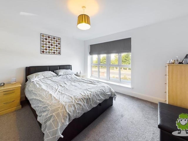 Time to inspect the bedrooms now, and here is the master on the first floor. Spacious with a large window overlooking the front of the house, it benefits from a walk-in wardrobe and an attractive en suite.