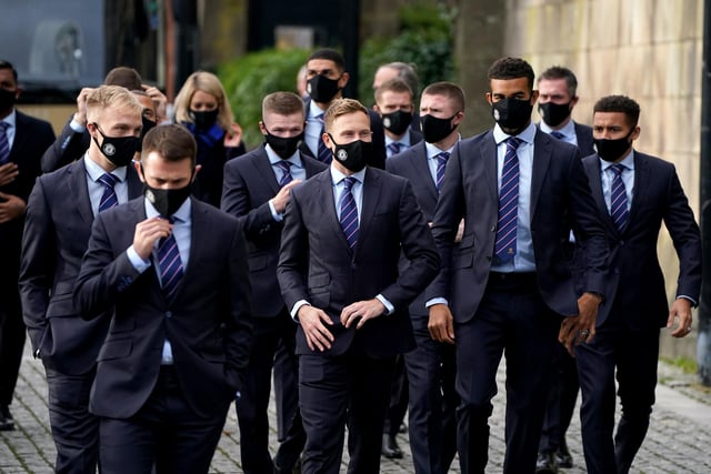 Rangers player Scott Arfield (centre) and his team-mates arrive for the memorial service at Glasgow Cathedral.