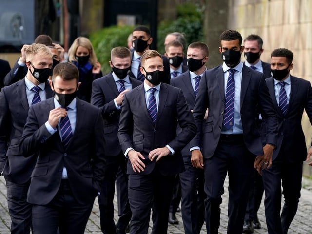 Rangers player Scott Arfield (centre) and his team-mates arrive for the memorial service at Glasgow Cathedral.