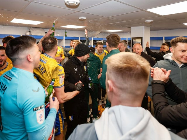 Mansfield Town's fans and players celebrated promotion to League One long into the night.