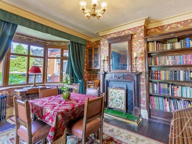 Just as elegant and elite as the living room is this dining room. Again there is solid oak flooring, a feature fireplace with surround, and a bay window facing the side of the property.