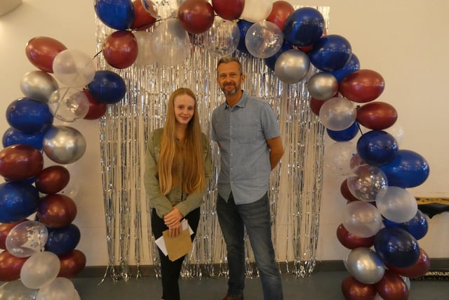 Grace Kennedy, who achieved a Grade 7 or above in all ten of her GCSEs, with Chris Woollard, headteacher
