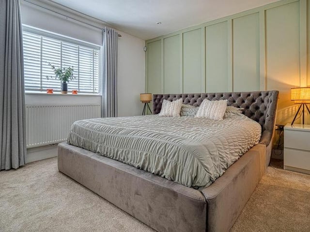 Of the five bedrooms, this is number one at the rear of the Selston property. A large space, it features panelled decor and fitted wardrobes and has access to an en suite shower room.