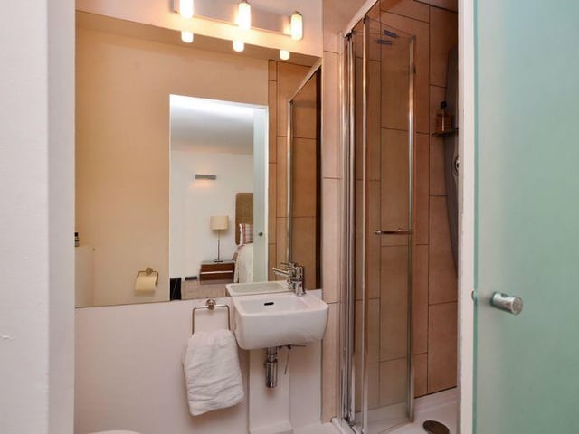 This modern en-suite has a shower.