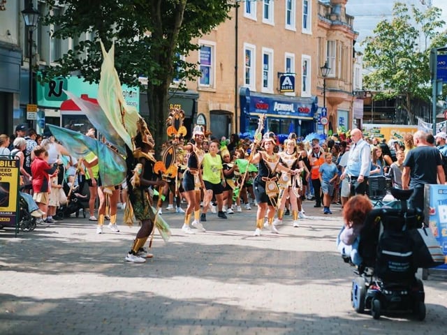 The parade was led by dance troupes, gymnasts and musicians