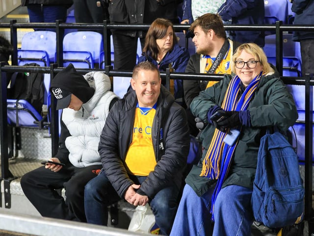 Travelling Mansfield Town fans during the Sky Bet League One match against AFC Wimbledon at Stadium Plough Lane.