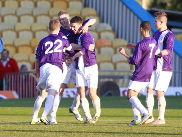 Bradley Raglan is mobbed after opening the scoring for Espial.