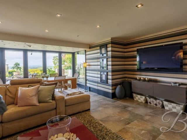 More evidence that the garden room is a real gem, with space for a dining table (in the background) and a big-screen TV.