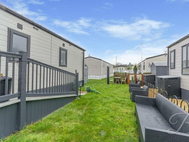 By the entrance to the property, there is space for another seating area on the turf outside.