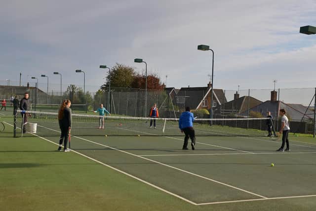 Junior club members on the courts at Mansfield Lawn Tennis Club