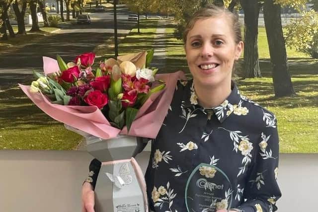Dr Rebecca Gibbs with her psychologist of the year award.