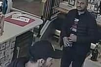 Police are investigating after two men stole a bottle of whisky worth up to £120 from a Nottinghamshire shop.