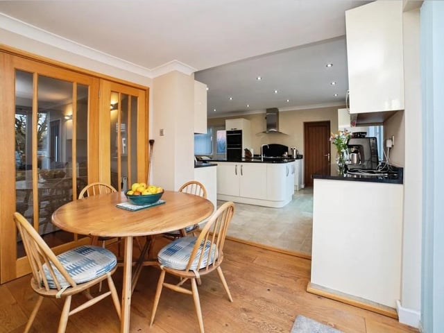 The heart of the home is the expansive open-plan kitchen and dining area, designed to feel bright, and effortlessly functional.