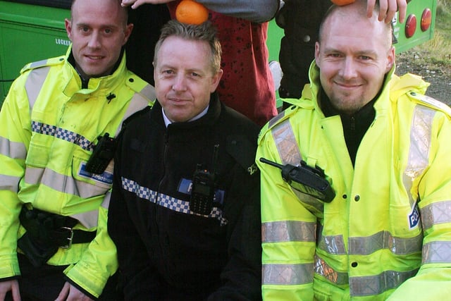 2008: This smiley trio are pictured with PCSO Tom Ford, PC Mike Topham and PC Mark Rainford at the Jacksdale Community Centre Mobile Youth Club.