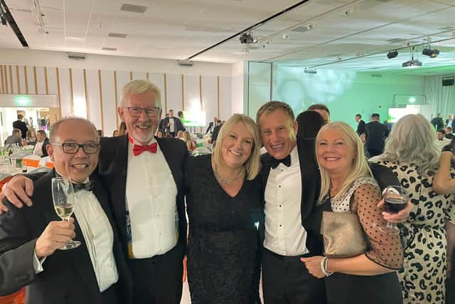 PICS medical director Dr Kelvin Lim (left) is pictured with Gerald Ellis, Ali Rounce, George Goward and George's wife at the business awards.