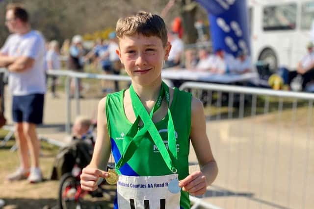 Jacob Nugent with his medals from the Midland 5K races.