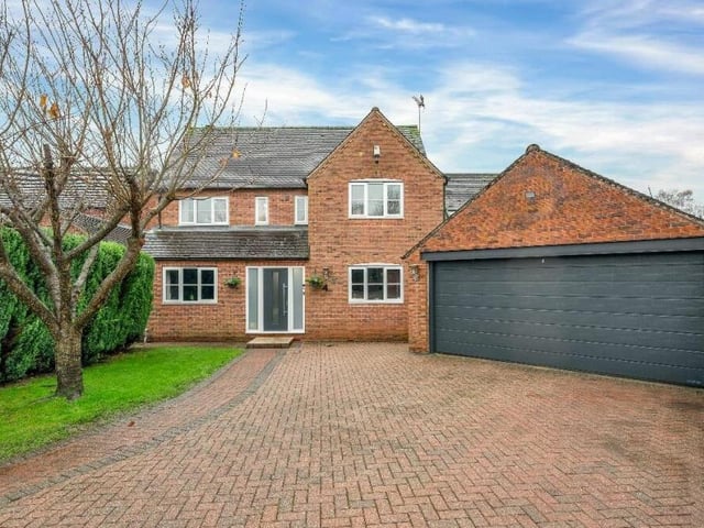 Access to the house is via a block-paved driveway that provides off-street parking space for several vehicles and also leads to a detached double garage, which is equipped with power and lighting.