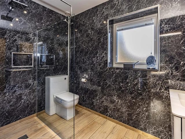 One of three stylish and contemporary bathrooms in the property