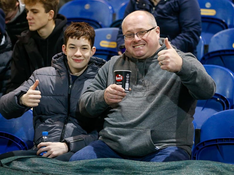 Mansfield Town's faces in the crowd against Swindon Town.