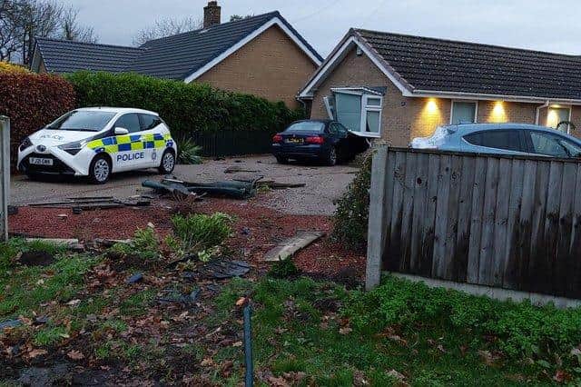 The vehicle smashed through the fence and crashed into the property
