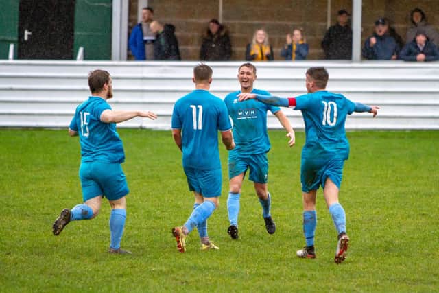 Charlie Dawes celebrates as Clipstone draw level.