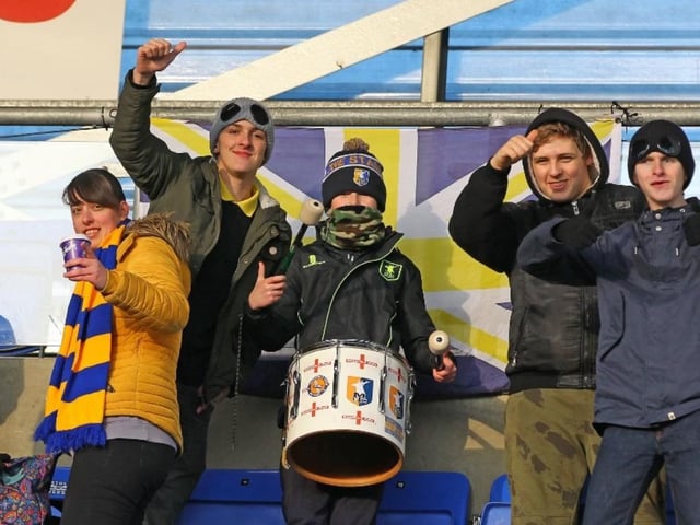 Stags fans get in the rhythm before the match.