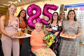 From left, sales advisors Jemma Hass and Kim Deakin, customer Audrey Welch, branch manager Joanne Wright, assistant manager Emma Whetton and optician Donna Whyborn celebrate the 85th anniversary of Scrivens at its Sutton branch. (Photo by: Scrivens Opticians & Hearing Care)