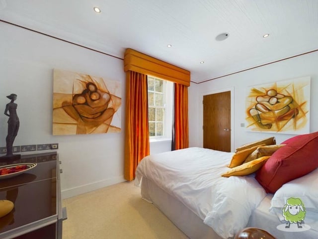 This bedroom also boasts a fitted dressing-room and access to an en suite bathroom.