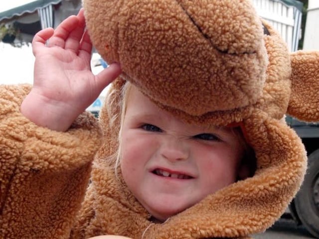 Lucy Waldron from Tibshelf Playgroup shelters from the rain in her Scooby Doo costume at the Tibshelf Carnival.