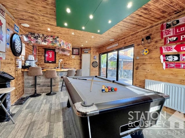 This generously proportioned bar area comes fully equipped with all you need and more to enjoy evenings with friends having bifold doors that provides a seamless transition onto the garden.