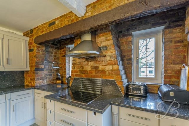 As you can see, although the kitchen is contemporary, with modern appliances, it has a traditional twist too, thanks to open-brick features and beams.