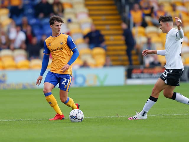 Mansfield Town defender James Clarke looks to make the cross during the Sky Bet League 2 match against Oldham Athletic AFC at the One Call Stadium 
Photo: Chris Holloway/The Bigger Picture.media