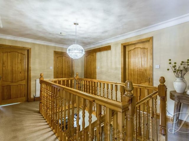 At the top of the stairs, you are greeted by this elegant first-floor landing, which leads to four well-proportioned bedrooms and a family bathroom.
