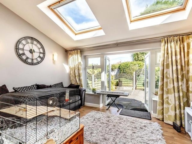 The annexe lounge is a bright and lively room, with French doors leading out to a low-maintenance patio area in the back garden. There are also two Velux roof windows, while the floor is laminated.