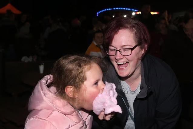Mum Deborah Parkin laughs as her daughter Sophie-Anne gets stuck into a face full of candyfloss back in 2019