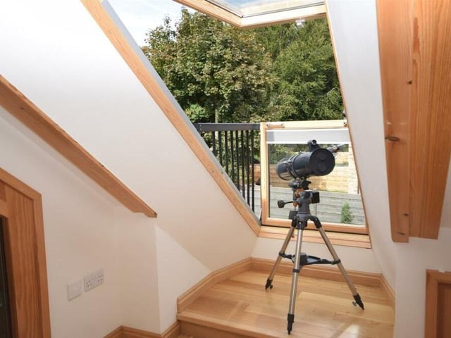 Don't miss out on the splendid views from the pop-out balcony roof window in the second bedroom at the Kighill Lane house.