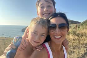 George with mum Caroline and his big brother.