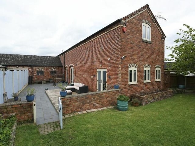This is a view of the side and rear of the unique Brinsley barn conversion.